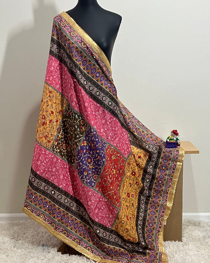 Malai silk dupatta in vibrant patchwork with a gold border, draped over a mannequin.