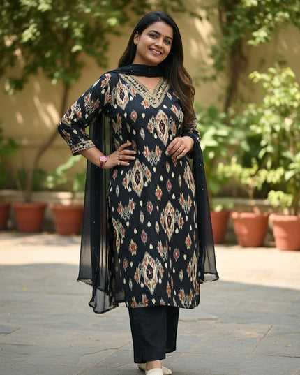 Kurti Connection USA black ikat print kurta with gold neckline, black pants, and sheer dupatta. Woman smiling outdoors.