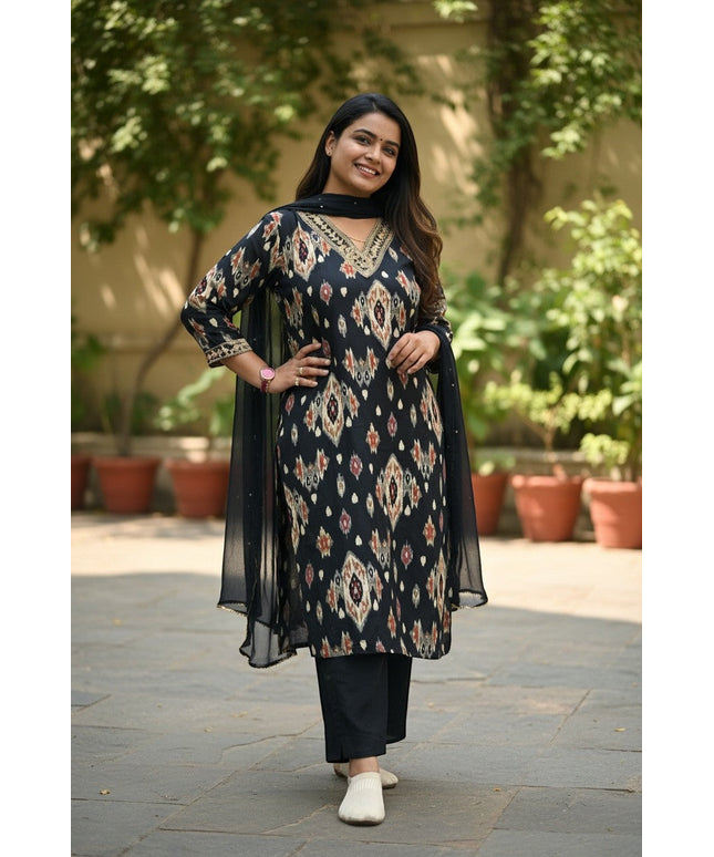 Kurti Connection USA black ikat print kurta with gold neckline, black pants, and sheer dupatta. Woman smiling outdoors.