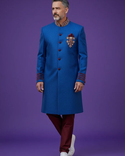 Kurti Connection USA blue sherwani jacket with red velvet accents, mandarin collar, and intricate chest embroidery.