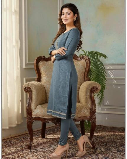 Model wearing a blue Kurti Connection USA tissue silk kurti with intricate embroidery, styled with matching leggings.