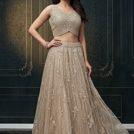 Kurti Connection USA champagne embellished sleeveless crop top and floor-length skirt set with intricate embroidery