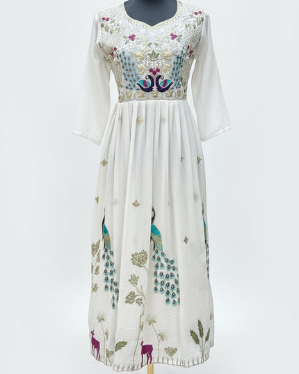Kurti Connection USA off-white Anarkali dress with vibrant peacock embroidery, V-neckline, and pleated skirt.