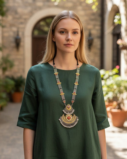 Kurti Connection USA traditional ethnic statement necklace with oxidized silver, gold accents, red stones, and pearls.