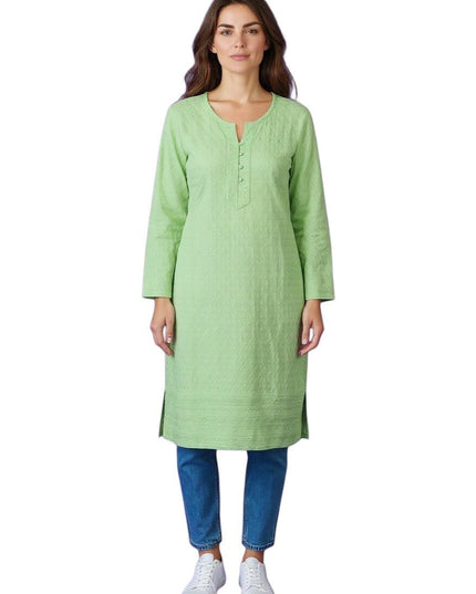 Kurti Connection USA light green textured cotton Chikankari kurti with button placket and side slits, worn by a woman with blue jeans.