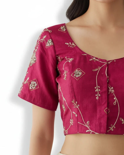 Kurti Connection USA hot pink ethnic blouse with intricate gold floral embroidery, scoop neckline, and short sleeves.