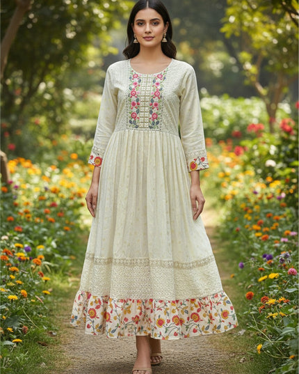 Kurti Connection USA long cream cotton kurti with floral embroidery and a flared hem worn by a model in a garden