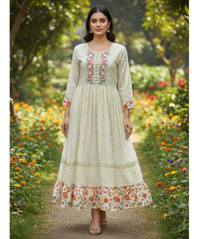 Kurti Connection USA long cream cotton kurti with floral embroidery and a flared hem worn by a model in a garden