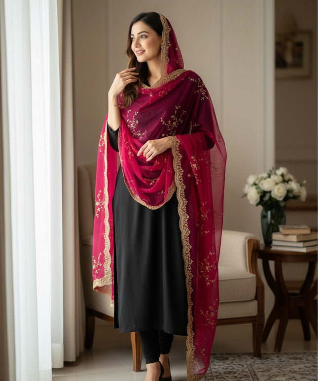 Kurti Connection USA tissue silk dupatta in deep magenta with intricate gold sequin embroidery draped over a black suit