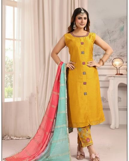 Kurti Connection USA mustard yellow sleeveless silk kurta set with floral trousers and a pink and turquoise dupatta.