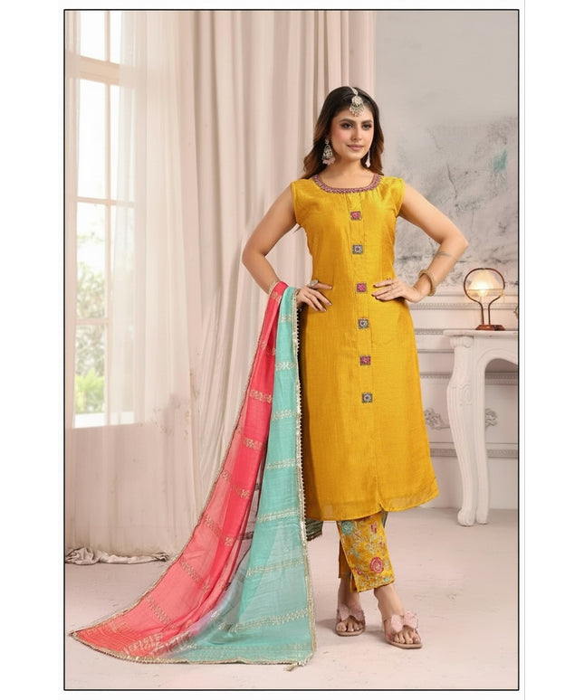 Kurti Connection USA mustard yellow sleeveless silk kurta set with floral trousers and a pink and turquoise dupatta.