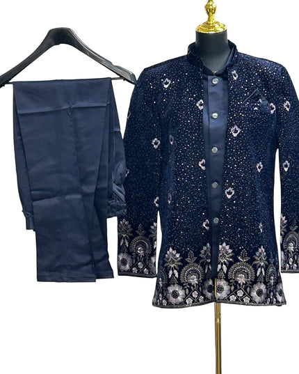 Kurti Connection USA navy blue embroidered Bandhgala suit with intricate silver and white floral embroidery on collar, cuffs, and hem. Includes matching trousers.