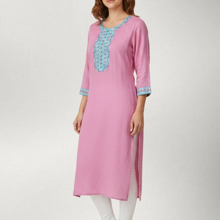 Kurti Connection USA pink kurti tunic with intricate blue embroidery on the neckline and cuffs worn with white leggings