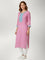 Kurti Connection USA pink kurti tunic with intricate blue embroidery on the neckline and cuffs worn with white leggings
