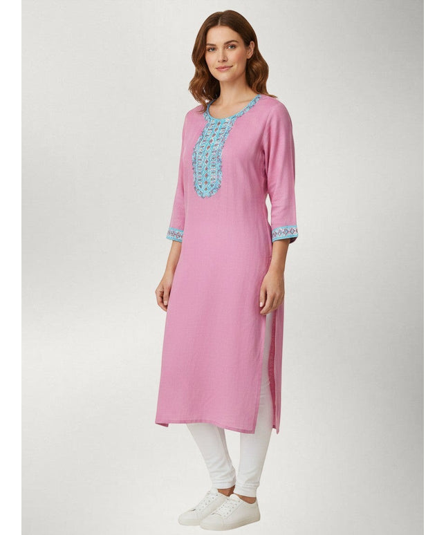 Kurti Connection USA pink kurti tunic with intricate blue embroidery on the neckline and cuffs worn with white leggings