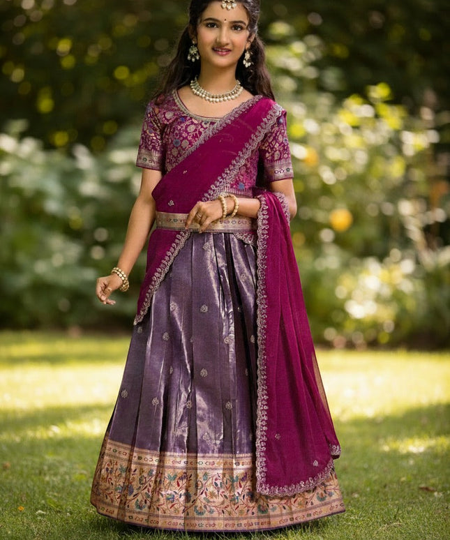 Girl wearing a Kurti Connection USA purple and grey pattu lehenga with intricate gold zari border and matching dupatta
