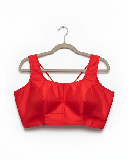 Kurti Connection USA red sleeveless ethnic crop top blouse with a square neckline and spaghetti straps on a hanger.