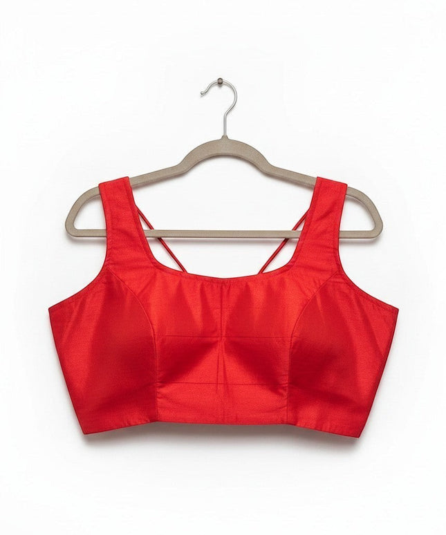 Kurti Connection USA red sleeveless ethnic crop top blouse with a square neckline and spaghetti straps on a hanger.
