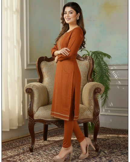 Kurti Connection USA rust orange tissue silk kurti with intricate embroidery, side slits, and matching leggings.