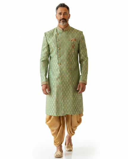 Kurti Connection USA sage green sherwani with golden motif pattern, mandarin collar, and matching golden dhoti pants.