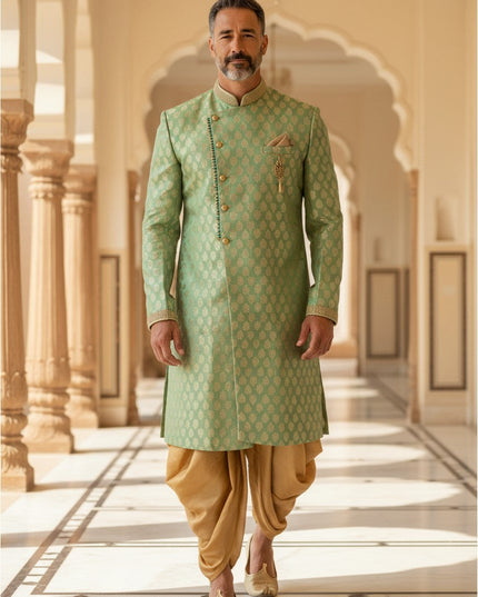 Kurti Connection USA sage green sherwani with golden motif pattern, mandarin collar, and gold dhoti for formal events.