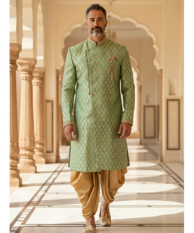 Kurti Connection USA sage green sherwani with golden motif pattern, mandarin collar, and gold dhoti for formal events.