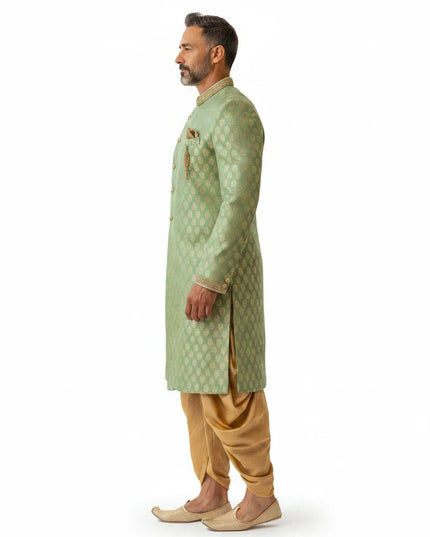 Kurti Connection USA sage green sherwani with gold motif pattern and dhoti pants, side view on a male model.