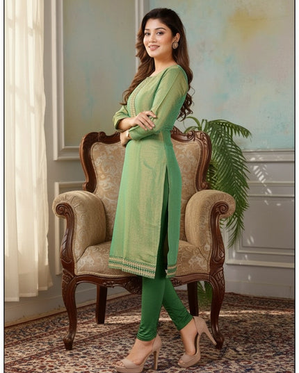 Kurti Connection USA sage green tissue silk kurti with intricate embroidery, three-quarter sleeves, and side slits.